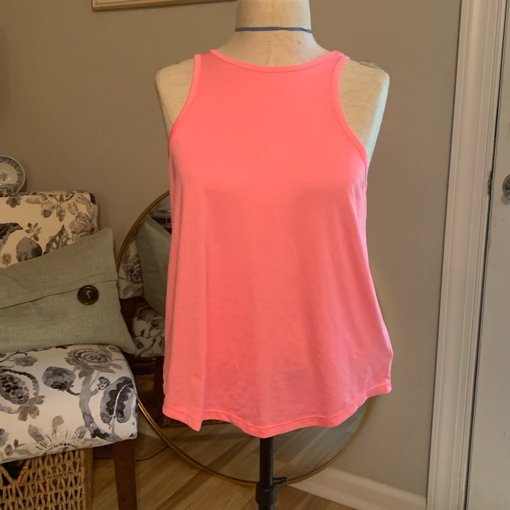 Pink workout top with open cross back